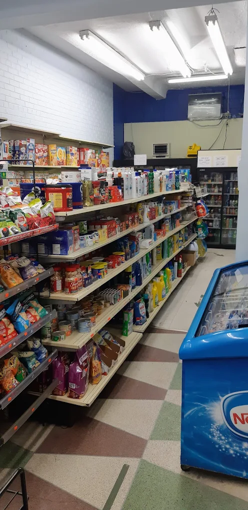 Aisles stocked with snacks, drinks, and everyday items at Sherwood Tuck Shop